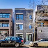 a front view of a building with parking space