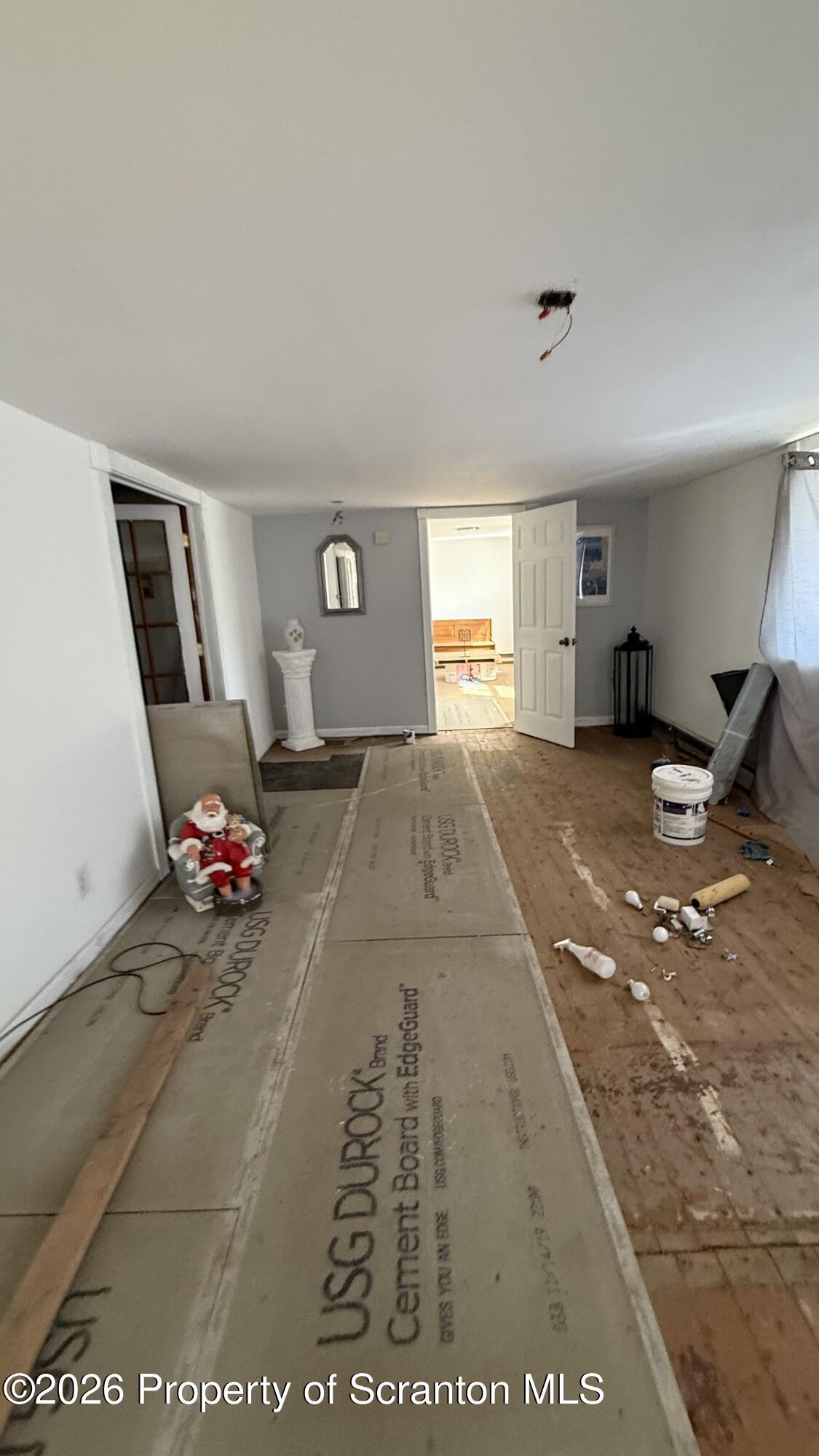 1140 Hampton Street Scranton, PA 18504 - Photo 2 of 8 a view of a livingroom with furniture and window