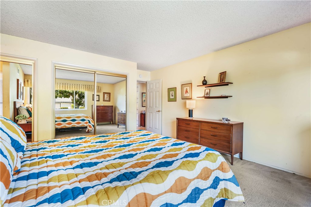 1423 La Canada Drive Brea, CA 92821 - Photo 11 of 43 a bedroom with a bed and a lamp on the dresser