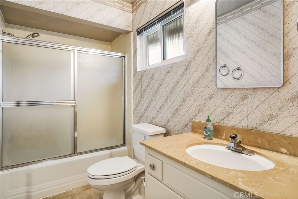1423 La Canada Drive Brea, CA 92821 - Photo 33 of 43 a bathroom with a granite countertop sink toilet and shower