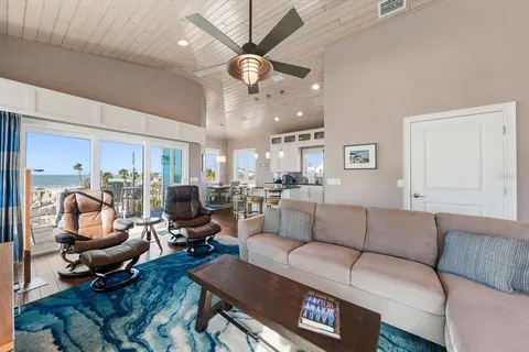 a spacious bedroom with a bed and a table in it