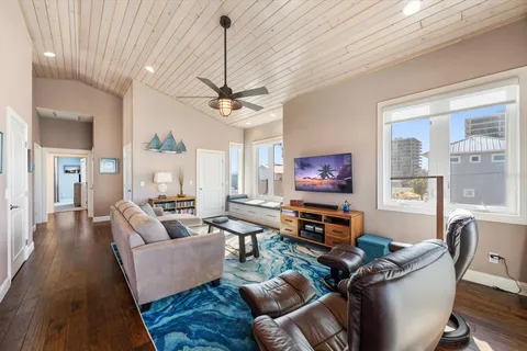 a bed room with a bed window and a ceiling fan