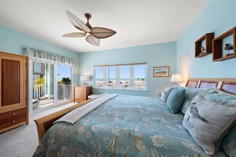 a view of a livingroom with workspace and a window