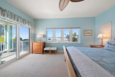 a living room with furniture a rug and a window