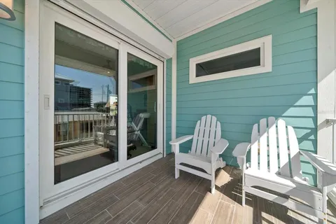 a bedroom with a bed a table and painting