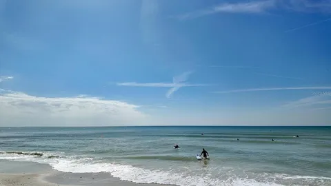 a dining room with furniture a chandelier and a rug