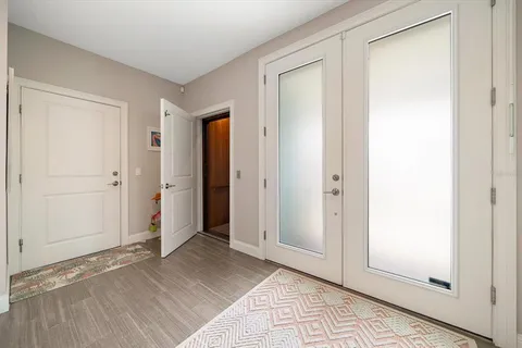 a living room with kitchen island furniture and a window