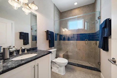 a view of a porch with wooden floor and windows