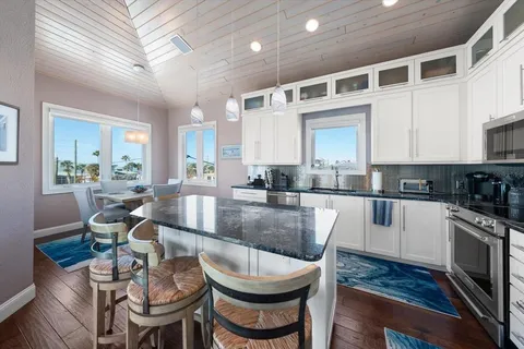 a view of a balcony dining table and chairs