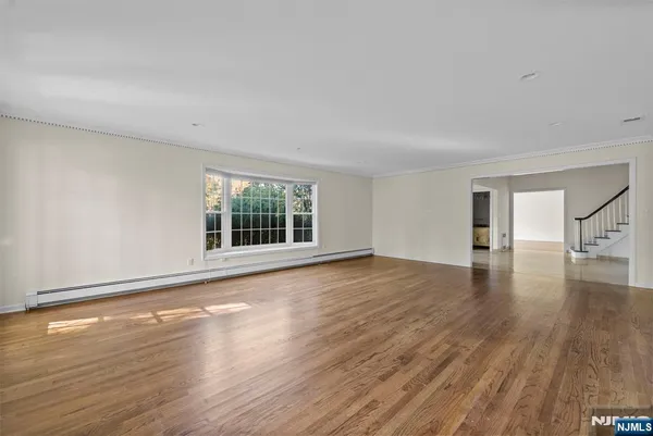 a kitchen with cabinets appliances and a window