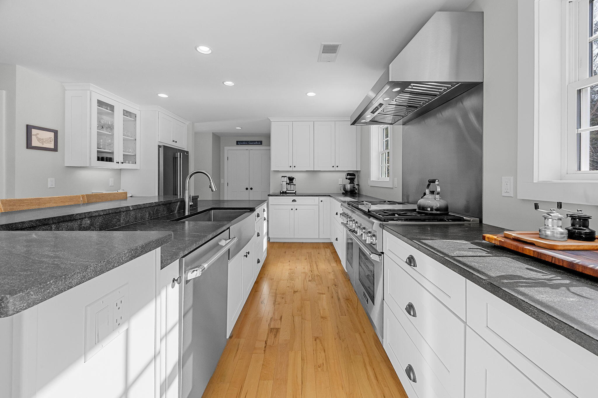 174 Cross Neck Road Marion, MA 02738 - Photo 9 of 41 a large kitchen with stainless steel appliances granite countertop a lot of counter space and wooden floors