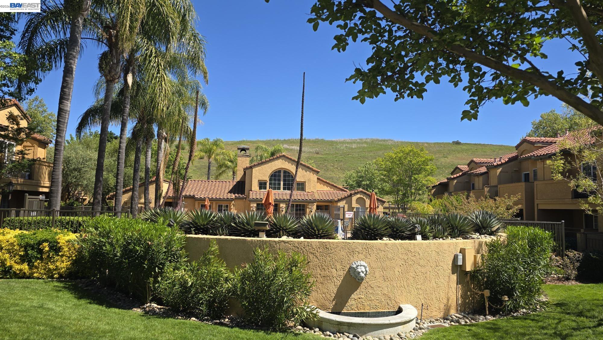 735 Watson Canyon Court, Unit 218 San Ramon, CA 94582 - Photo 19 of 26 a view of a swimming pool with a garden
