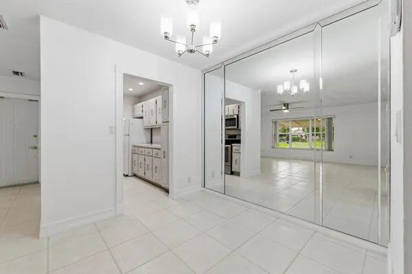 a view of a hallway with a chandelier