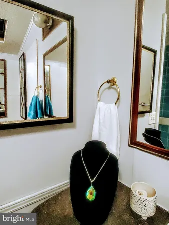 a room with a wooden floor and mirror