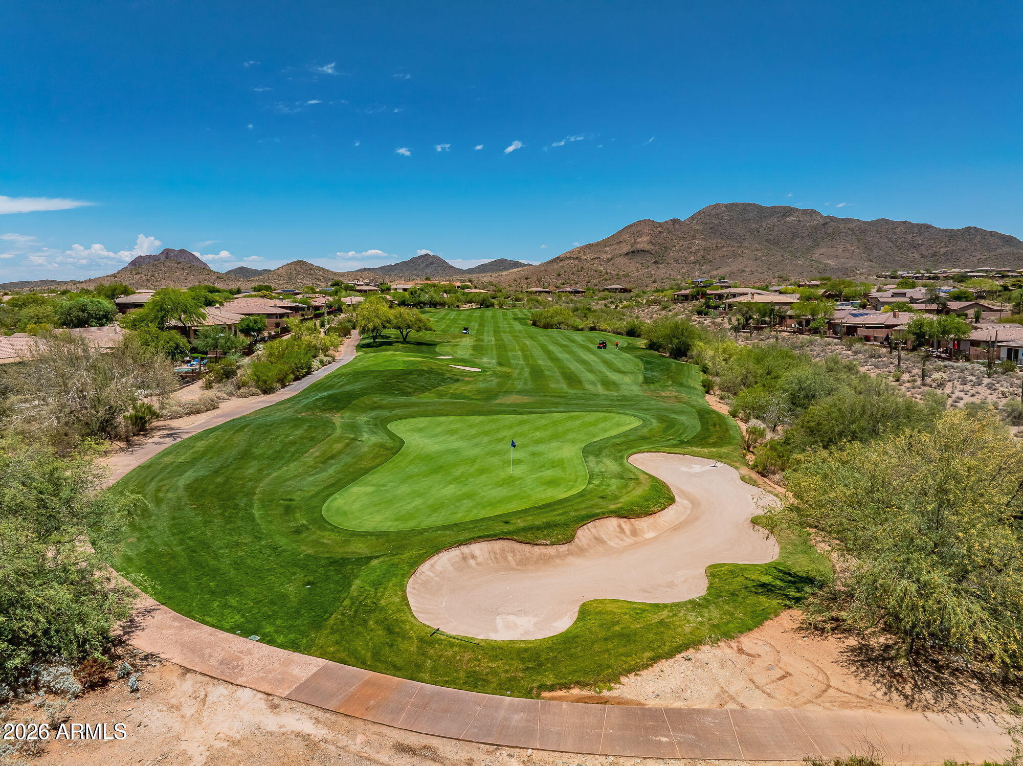41749 North Golf Crest Road Anthem, AZ 85086 - Photo 34 of 45 a view of a lush green hillside and a houses