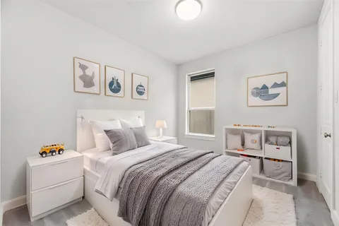 a bedroom with a bed and a couch