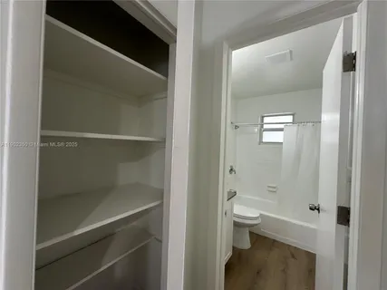a bathroom with a shower and a toilet