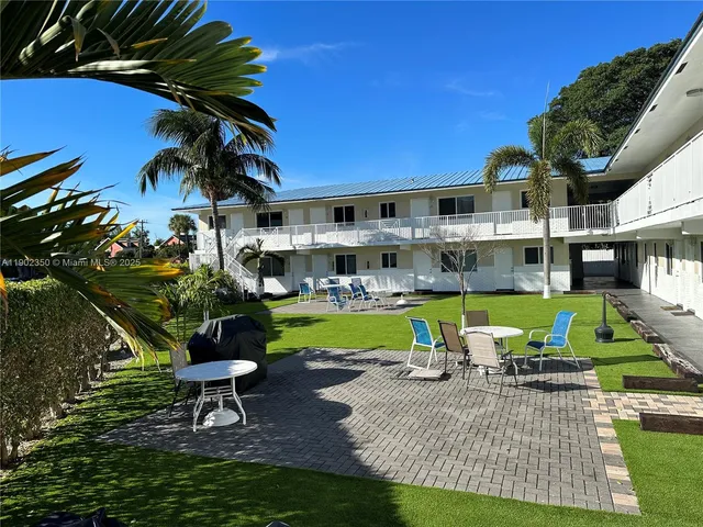 a view of a swimming pool with a patio
