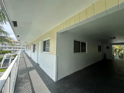 a view of a hallway with washer and dryer