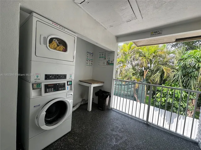 a view of a house with swimming pool and sitting area