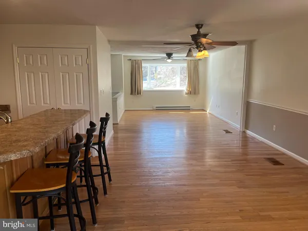 a view of a dining room with furniture and window