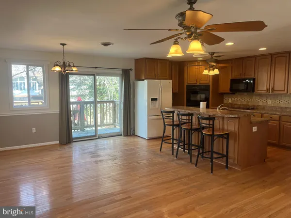 a view of a kitchen and dining room