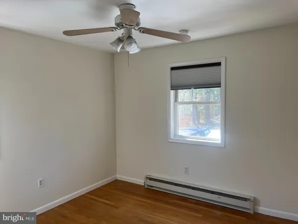 a view of room with window and ceiling fan
