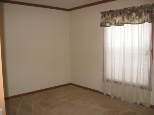 407 James Road Elwood, IL 60421 - Photo 12 of 15 a view of a small space with wooden floor and a window