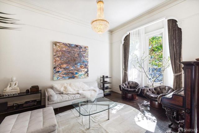 a living room with fireplace furniture and a flat screen tv