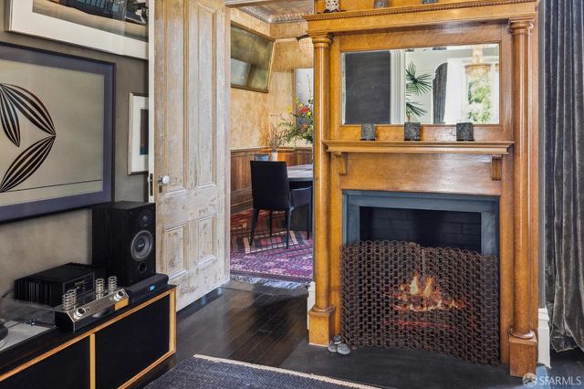 a view of a dining room with furniture wooden floor and chandelier