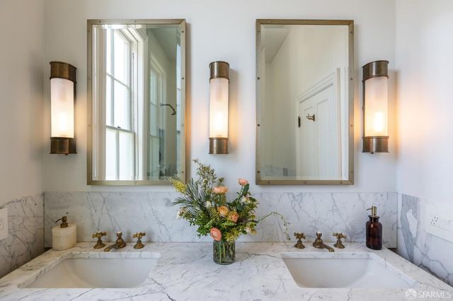 a bedroom with furniture and wooden floor
