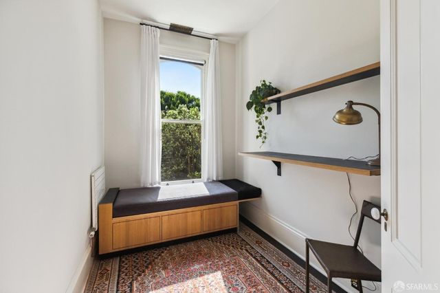 a view of a backyard with chairs