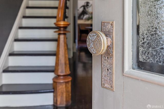 a view of a hallway with paintings on the wall