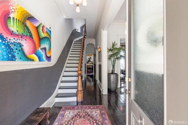 a view of entryway with wooden floor