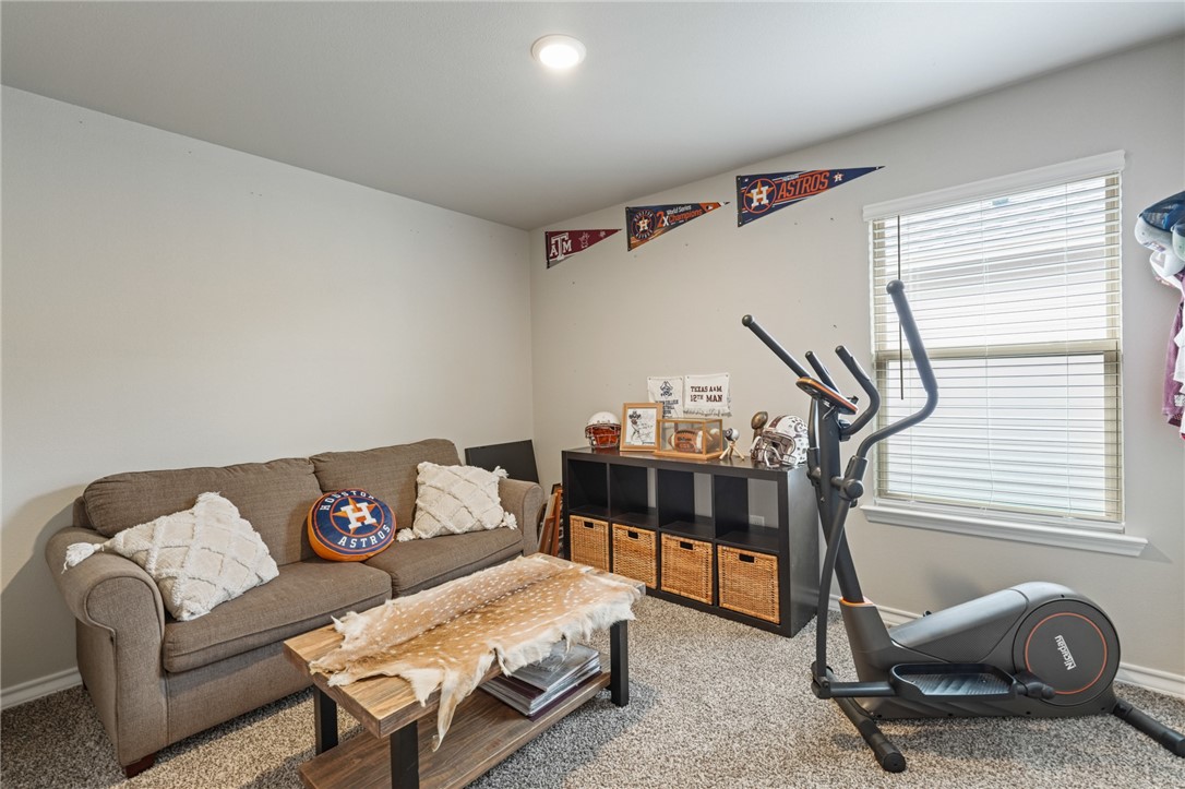 103 Donegal Street Sinton, TX 78387 - Photo 11 of 29 a bedroom with furniture and a window