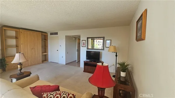 a workspace with furniture and a window