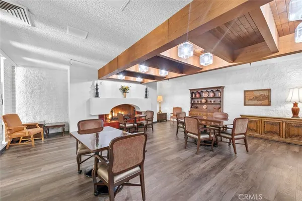 a view of a patio with table and chairs