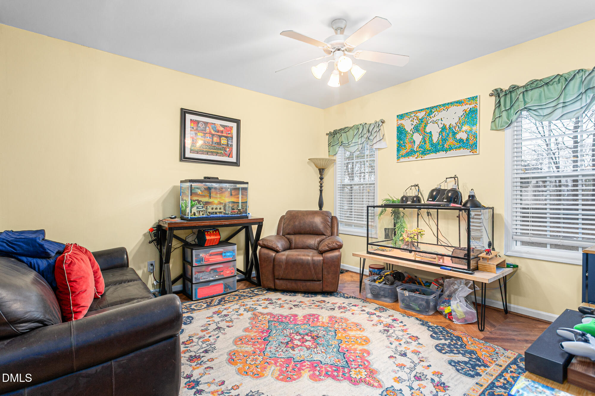 1205 Magnolia Hill Road Garner, NC 27529 - Photo 12 of 41 a living room with furniture and a flat screen tv
