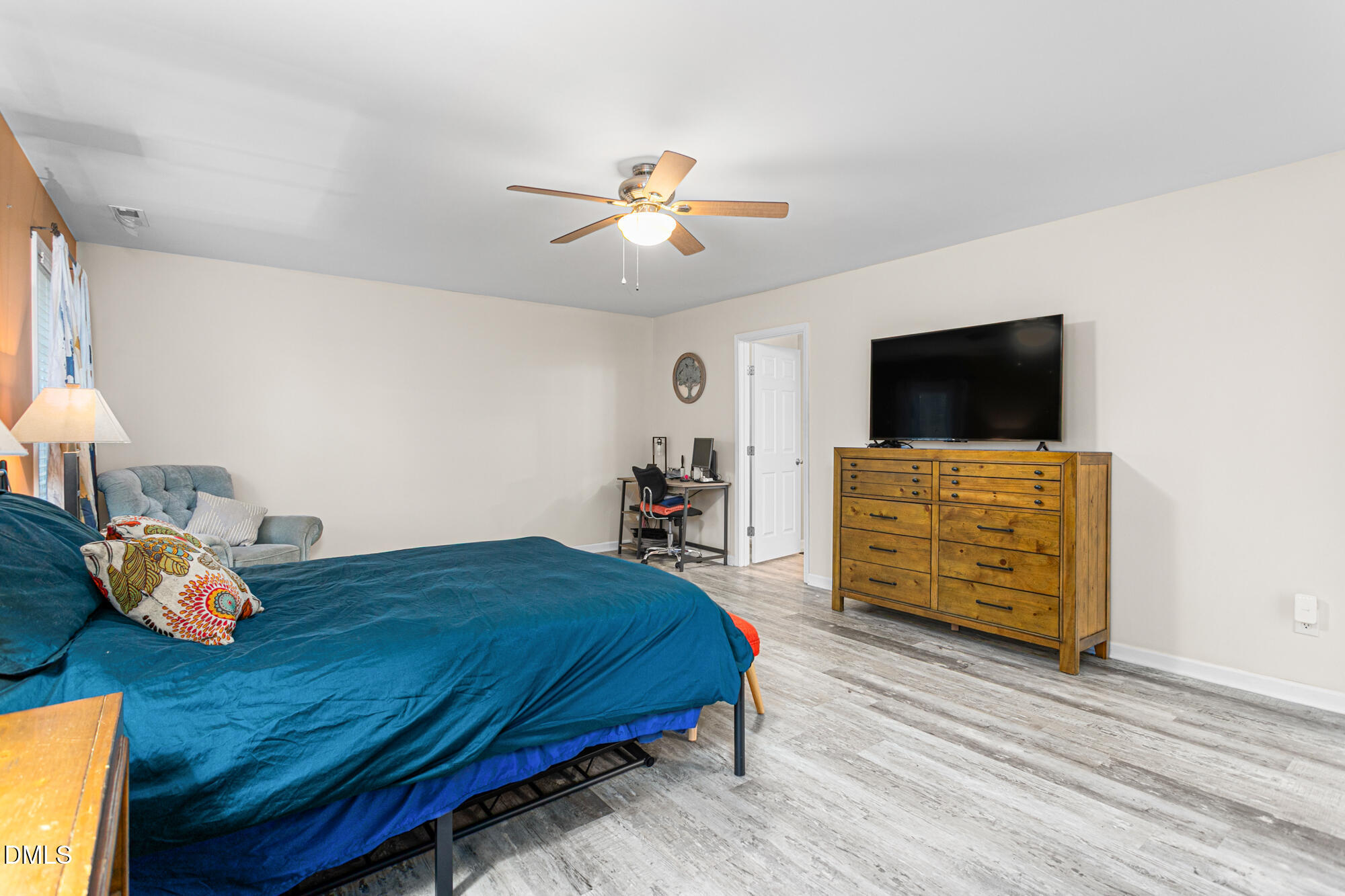 1205 Magnolia Hill Road Garner, NC 27529 - Photo 16 of 41 a bedroom with a bed and wooden floor