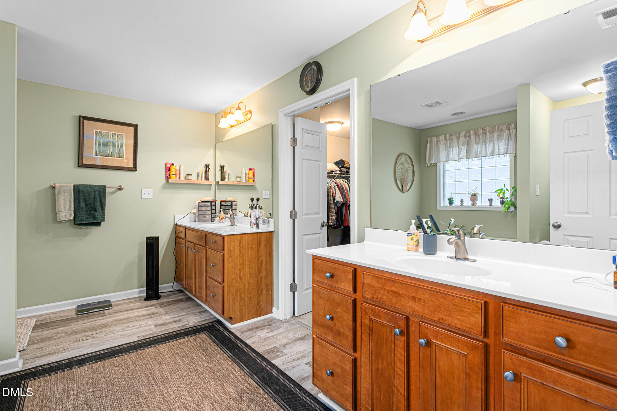 1205 Magnolia Hill Road Garner, NC 27529 - Photo 18 of 41 a spacious bathroom with a double vanity sink a mirror and a