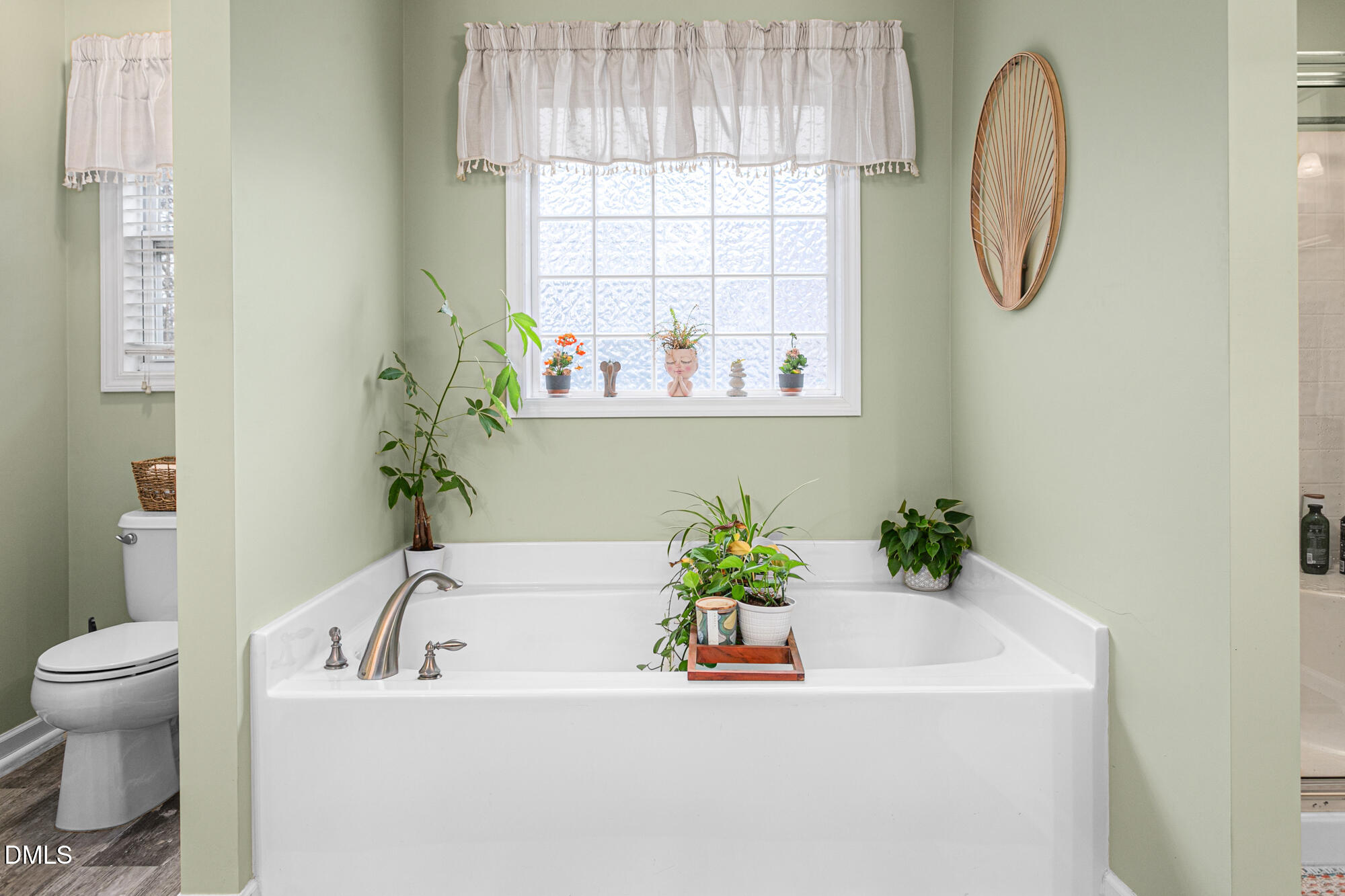 1205 Magnolia Hill Road Garner, NC 27529 - Photo 20 of 41 a white bath tub with a potted plant