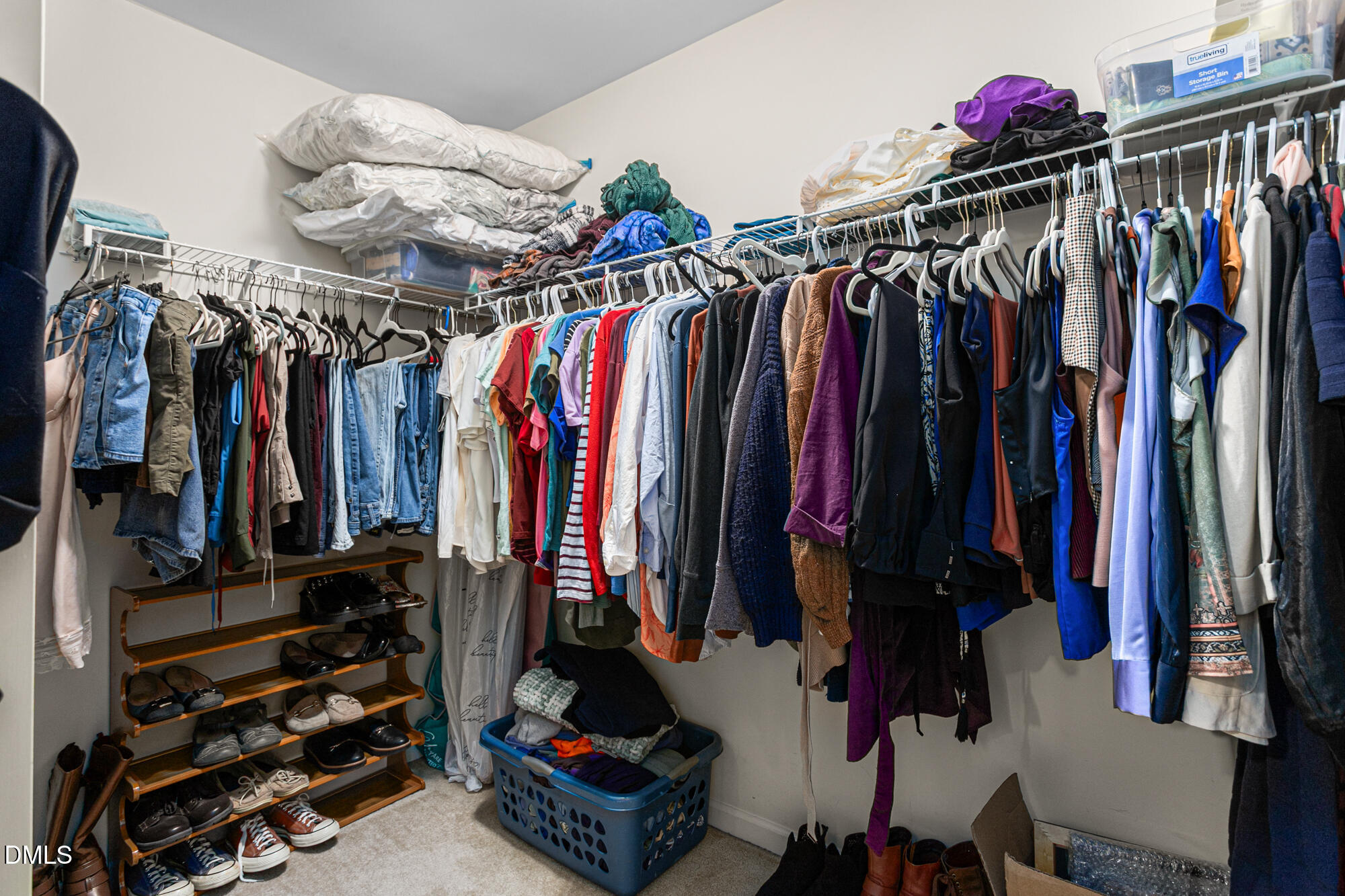 1205 Magnolia Hill Road Garner, NC 27529 - Photo 22 of 41 a view of walk in closet with clothes and shoes