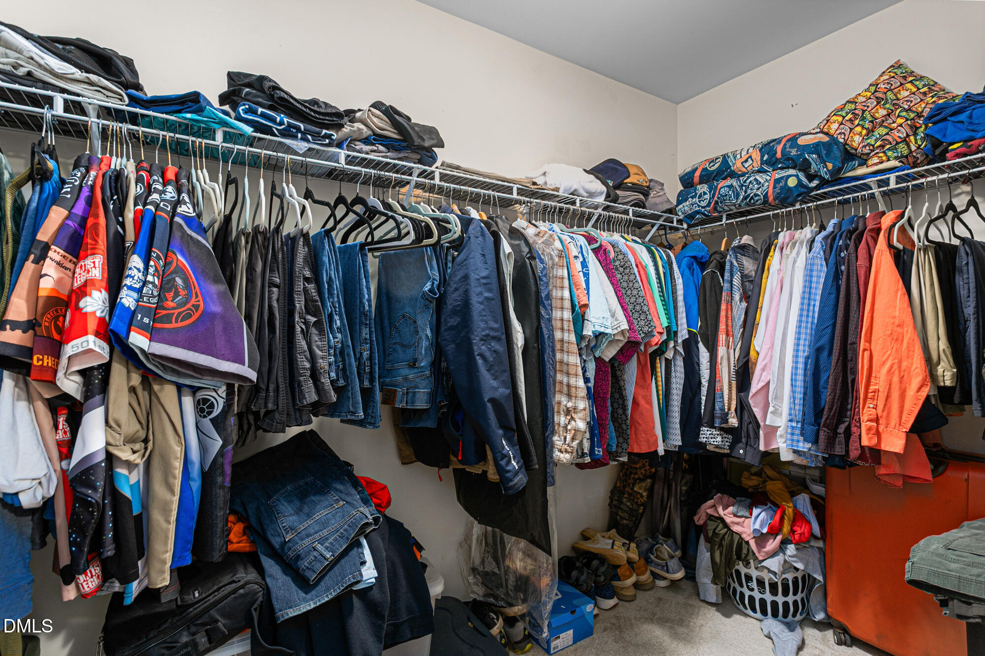1205 Magnolia Hill Road Garner, NC 27529 - Photo 23 of 41 a view of walk in closet with clothes
