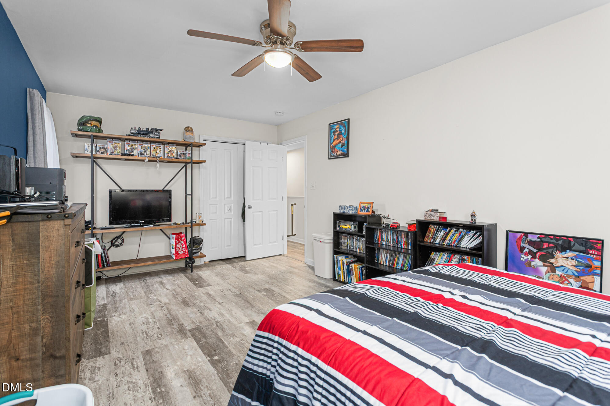 1205 Magnolia Hill Road Garner, NC 27529 - Photo 25 of 41 a living room with furniture and a flat screen tv