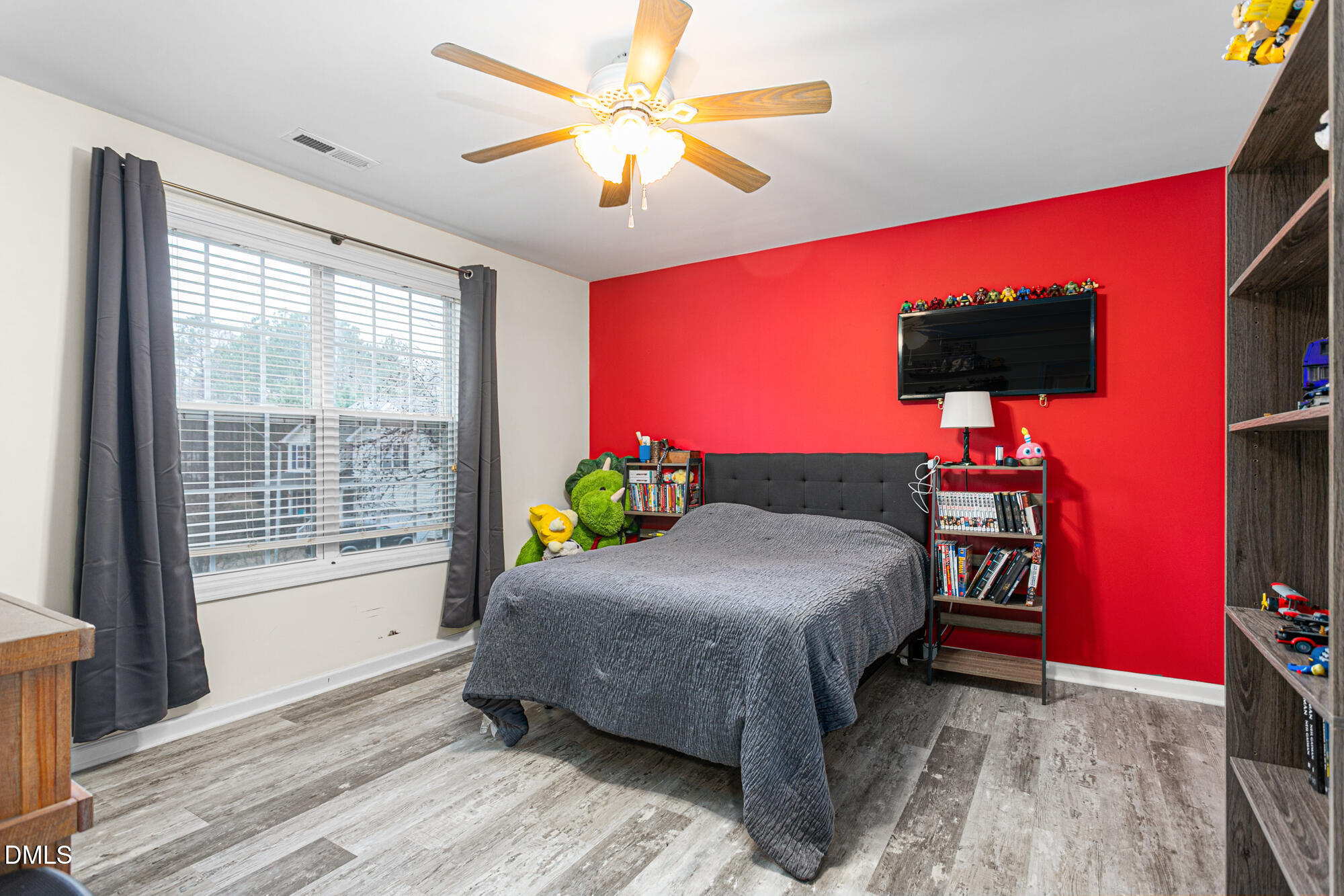 1205 Magnolia Hill Road Garner, NC 27529 - Photo 27 of 41 a bedroom with a bed table and a window
