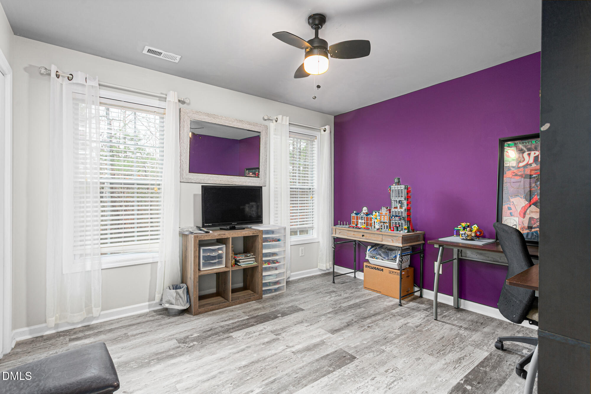 1205 Magnolia Hill Road Garner, NC 27529 - Photo 31 of 41 a living room with furniture and a flat screen tv