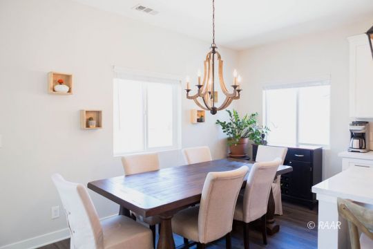 419 Abigail Street Ridgecrest, CA 93555 - Photo 17 of 34 a view of a dining room with furniture window and wooden floor