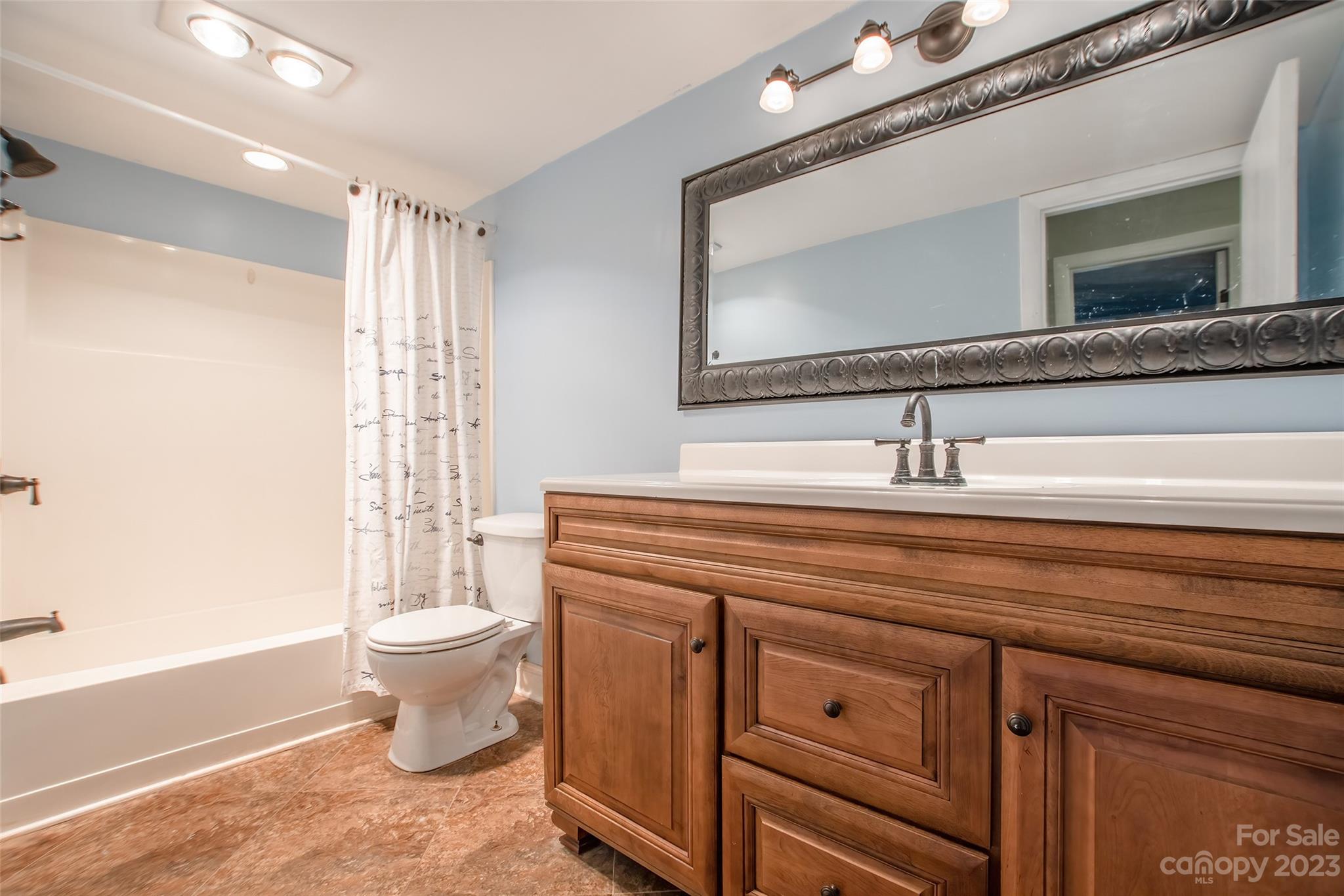 93 Ridgeport Road Lake Wylie, SC 29710 - Photo 18 of 38 a bathroom with a toilet sink and mirror
