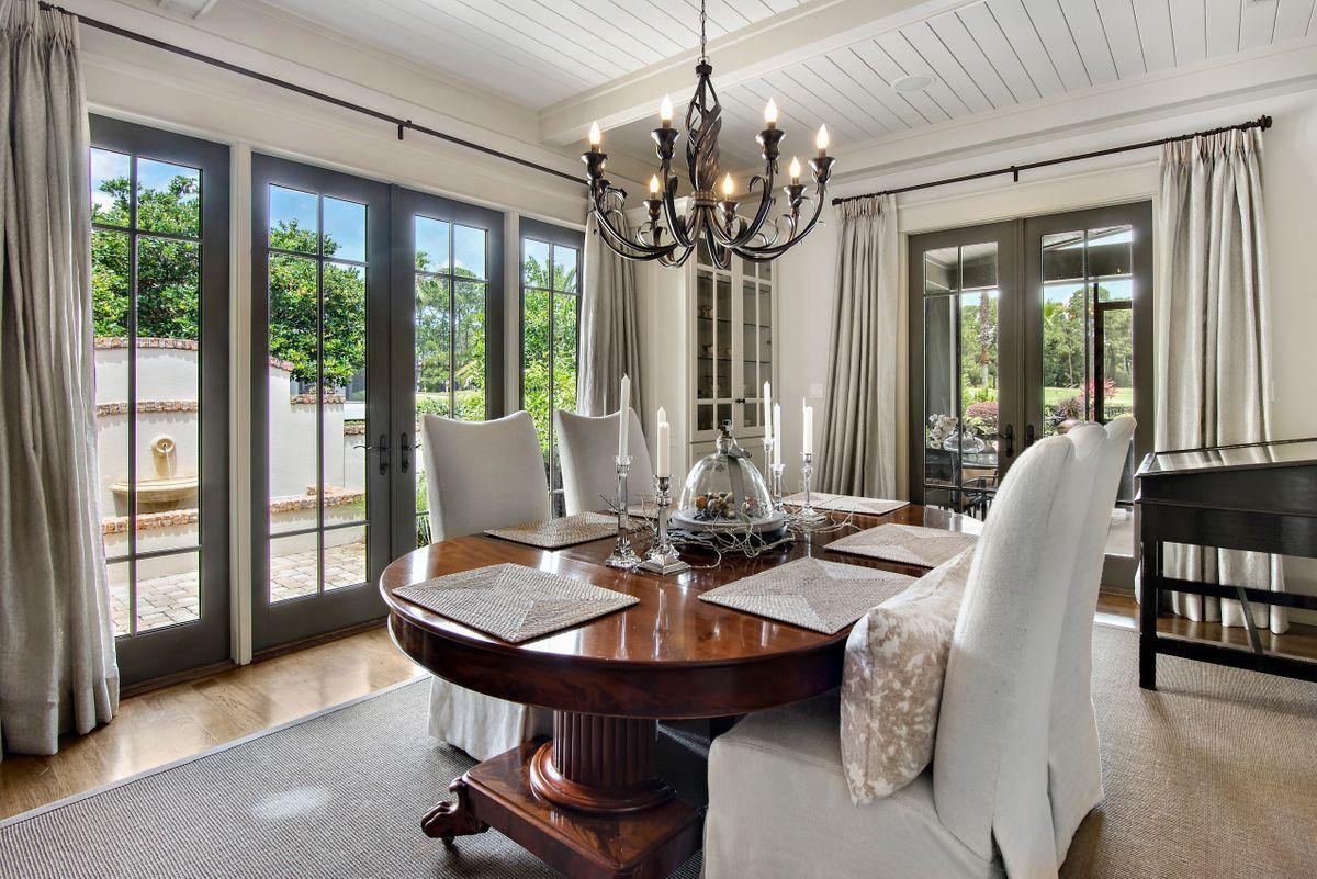 2955 Pine Valley Road Miramar Beach, FL 32550 - Photo 14 of 33 a view of a dining room with furniture wooden floor and chandelier