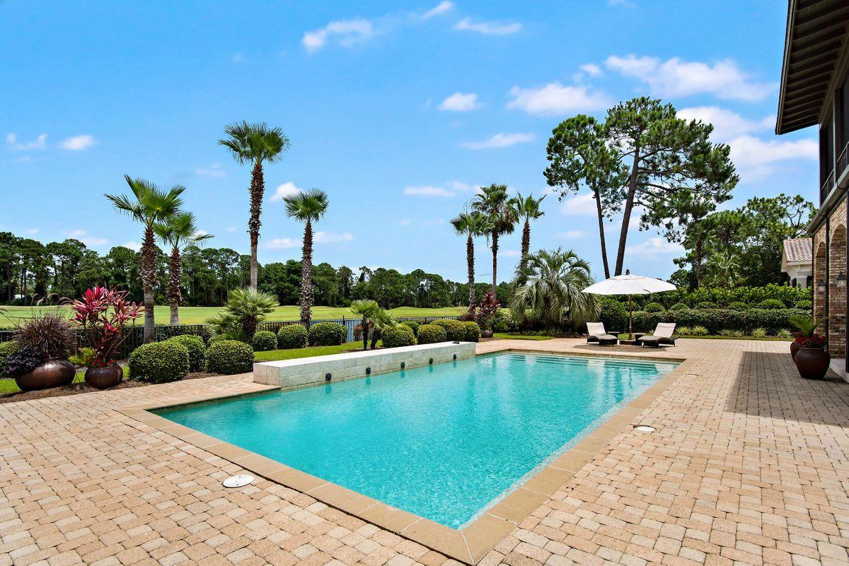 2955 Pine Valley Road Miramar Beach, FL 32550 - Photo 4 of 33 a view of a swimming pool and lounge chair